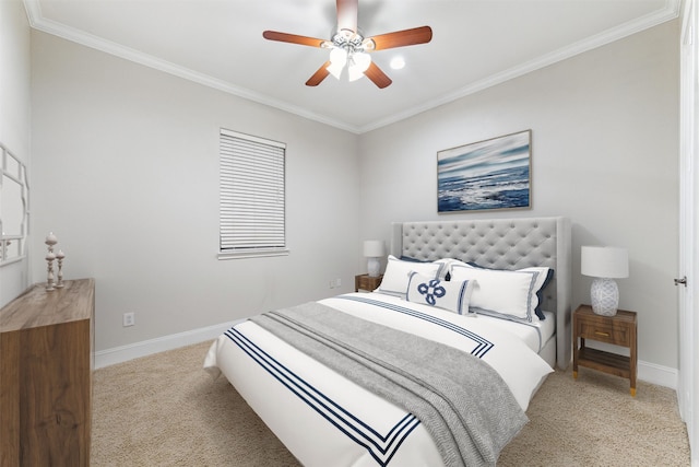 carpeted bedroom with ceiling fan and ornamental molding