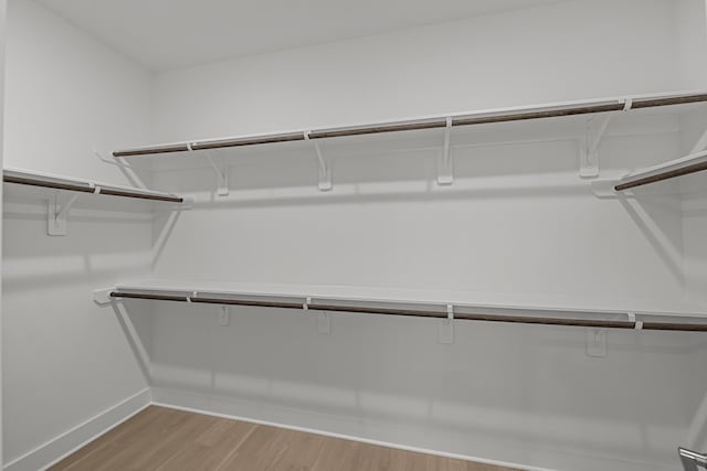 walk in closet featuring light wood-type flooring