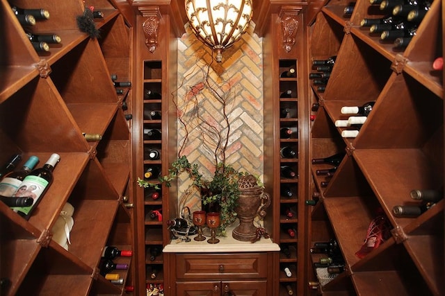 wine room with an inviting chandelier