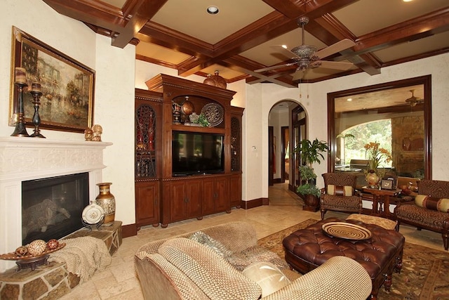 living room with ceiling fan, beamed ceiling, and coffered ceiling