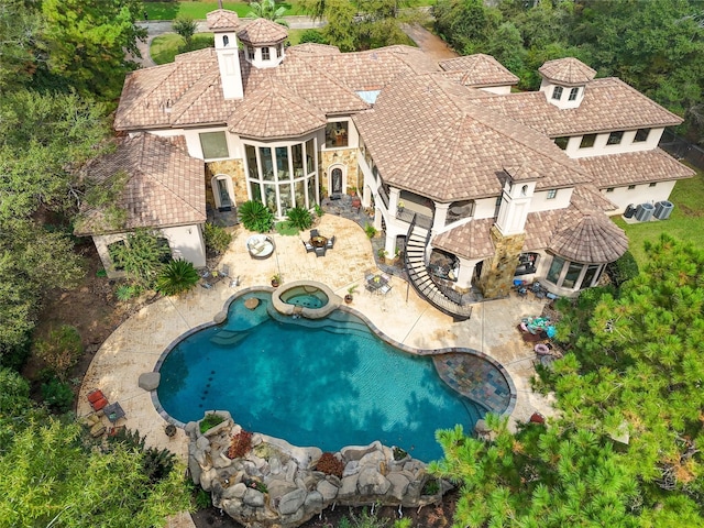23 Villeroy Way, The Woodlands, TX 77382 - outdoor pool with an in-ground hot tub and a patio area