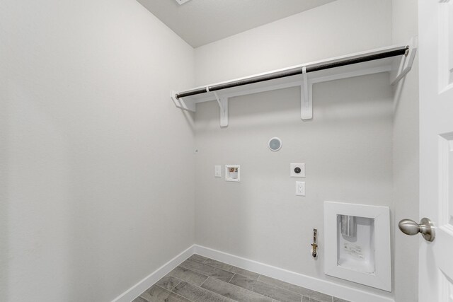 22126 Oceania Shores Dr, Hockley, TX 77447 - washroom with gas dryer hookup, washer hookup, baseboards, electric dryer hookup, and light wood-type flooring