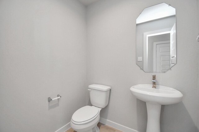 22126 Oceania Shores Dr, Hockley, TX 77447 - half bathroom with baseboards and toilet