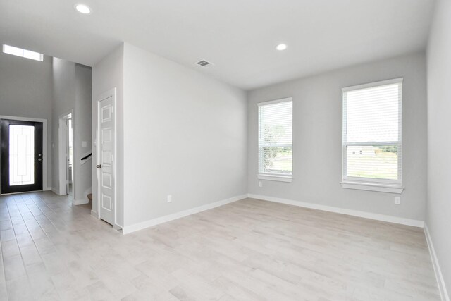 22126 Oceania Shores Dr, Hockley, TX 77447 - empty room featuring light wood-style floors, recessed lighting, and baseboards