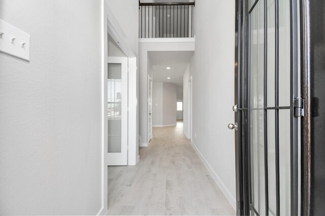 22126 Oceania Shores Dr, Hockley, TX 77447 - hallway featuring wood finished floors and baseboards