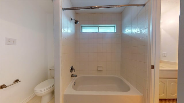 full bathroom with vanity, tile patterned flooring, toilet, and tiled shower / bath