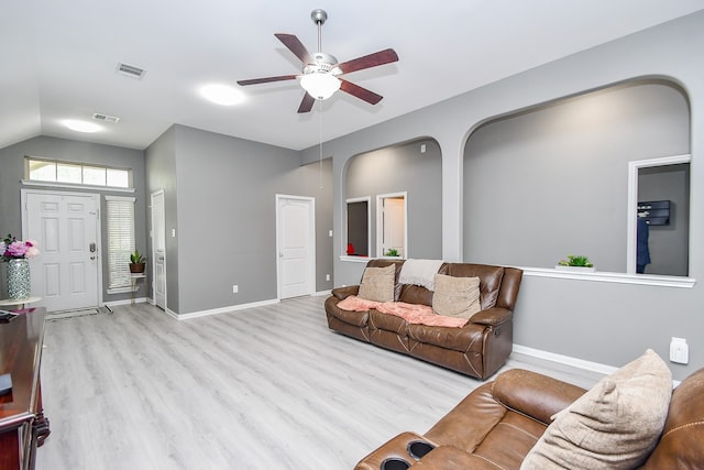 living room featuring light wood-type flooring, lofted ceiling, and ceiling fan