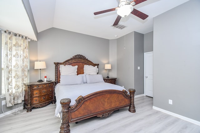 bedroom with lofted ceiling, ceiling fan, and light hardwood / wood-style flooring