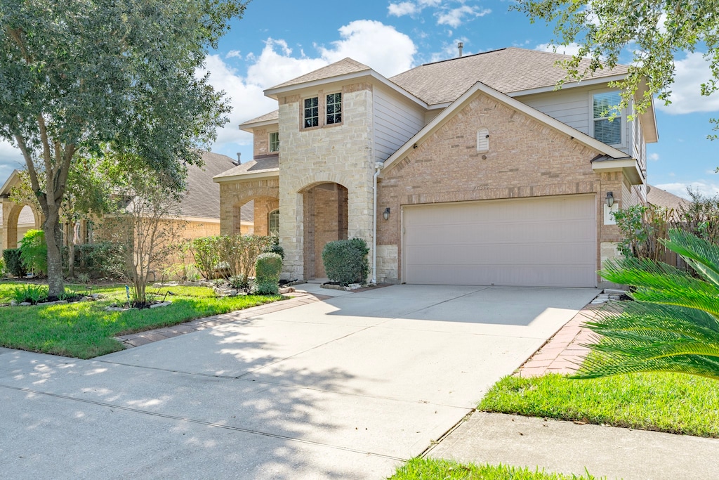 view of front of property with a garage