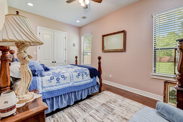 bedroom with hardwood / wood-style floors, ceiling fan, and a closet