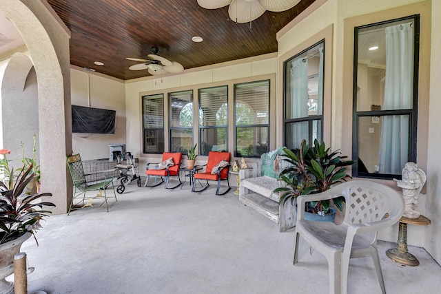 view of patio featuring ceiling fan