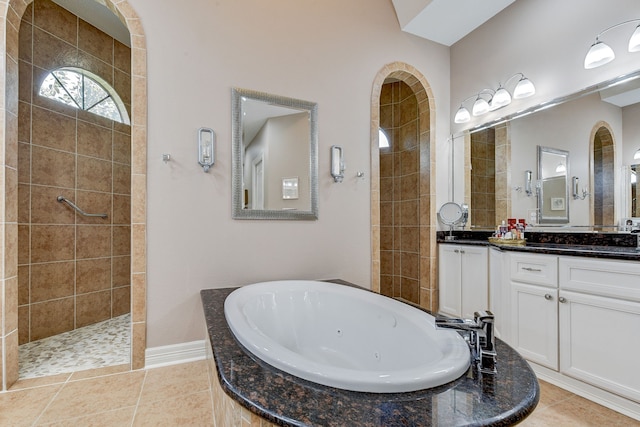 bathroom with vanity, tile patterned floors, and independent shower and bath