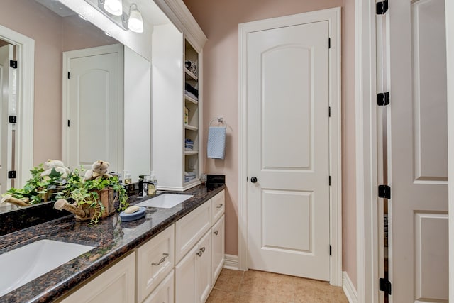 bathroom with vanity and tile patterned floors