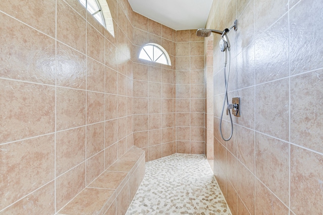 bathroom with tiled shower