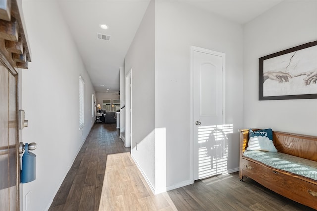 hall with dark hardwood / wood-style floors