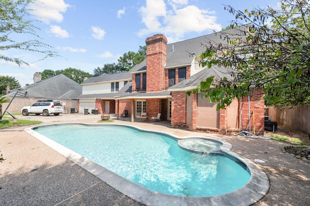 15007 Terrace Oaks Dr, Houston, TX 77068 - view of swimming pool featuring fence, a patio area, and a pool with connected hot tub
