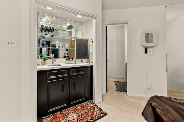 bar with sink and light carpet