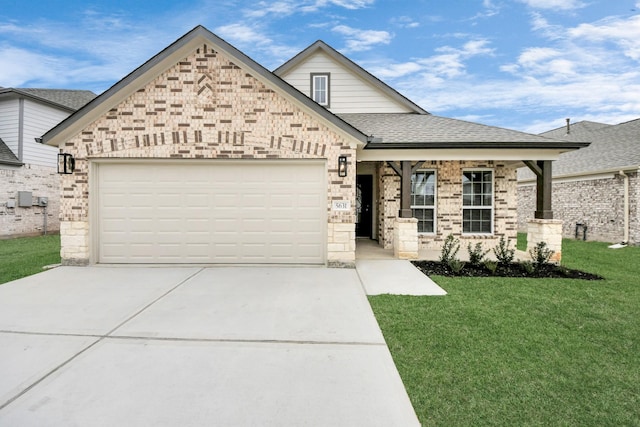 view of front of house with a garage and a front yard