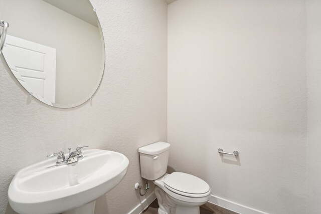 bathroom with toilet and sink