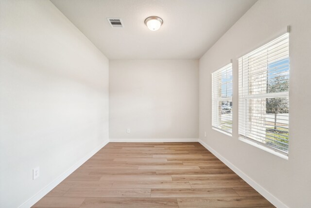 spare room with light wood-type flooring