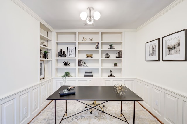 office area featuring crown molding and built in features