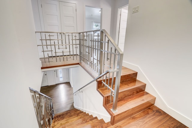 stairs with wood-type flooring