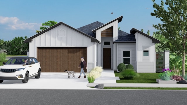 view of front of property with a garage and a front lawn