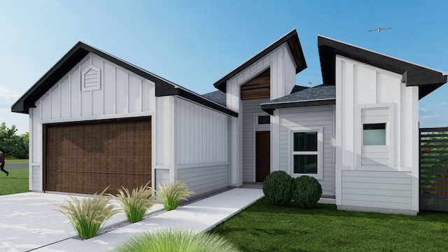 view of front of home with a garage and a front yard