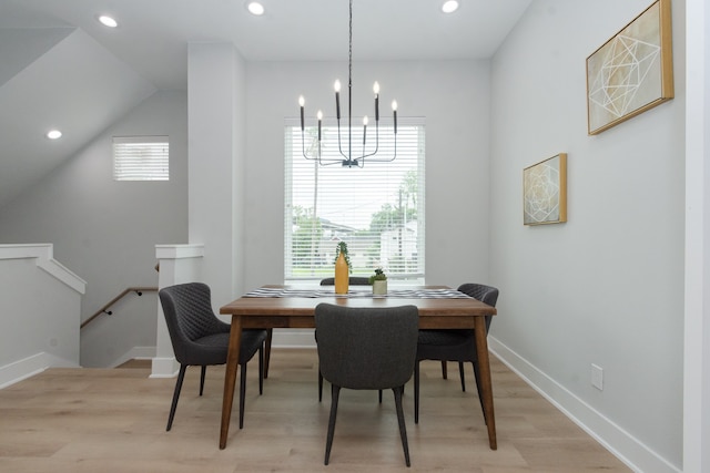 dining space featuring a chandelier, light hardwood / wood-style flooring, and plenty of natural light