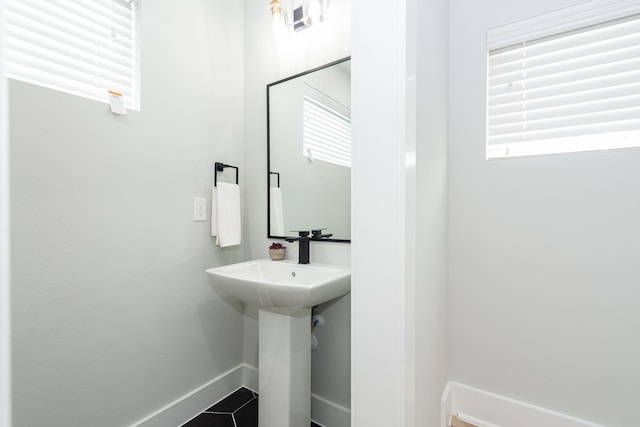 bathroom with sink and tile patterned flooring