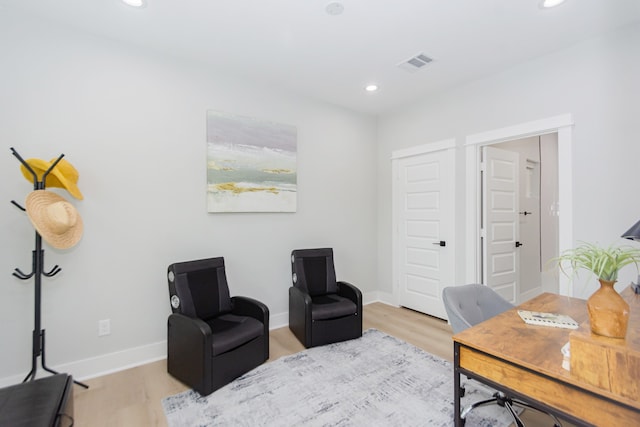 office area with light hardwood / wood-style flooring