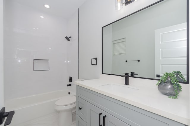 full bathroom featuring shower / washtub combination, vanity, and toilet