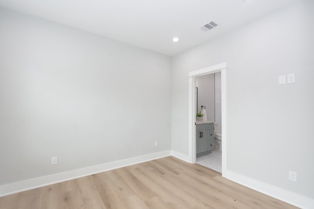 spare room featuring light wood-type flooring