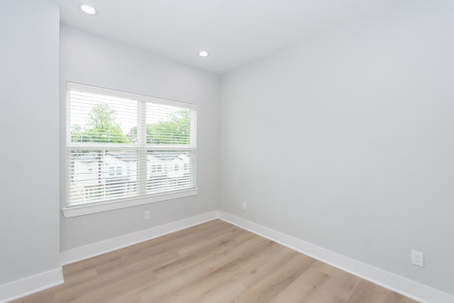 unfurnished room with light wood-type flooring