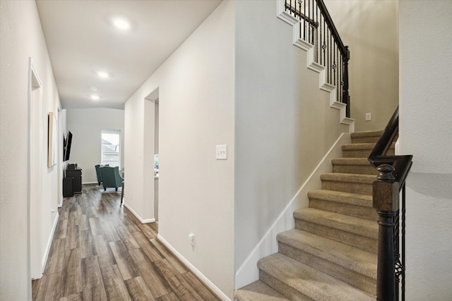 hall with hardwood / wood-style flooring