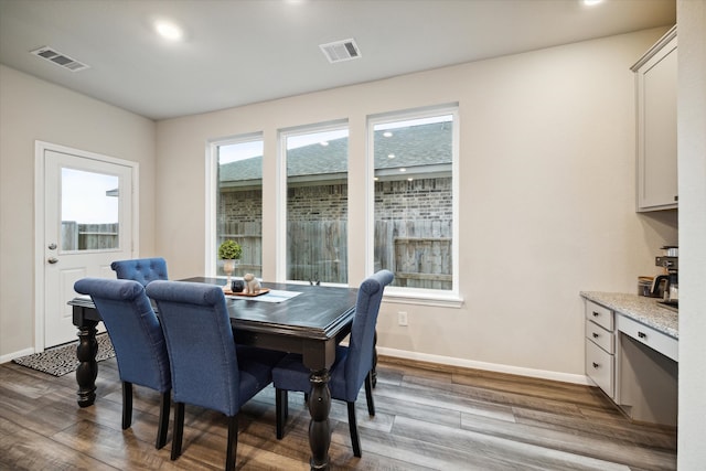 dining space featuring light wood-type flooring