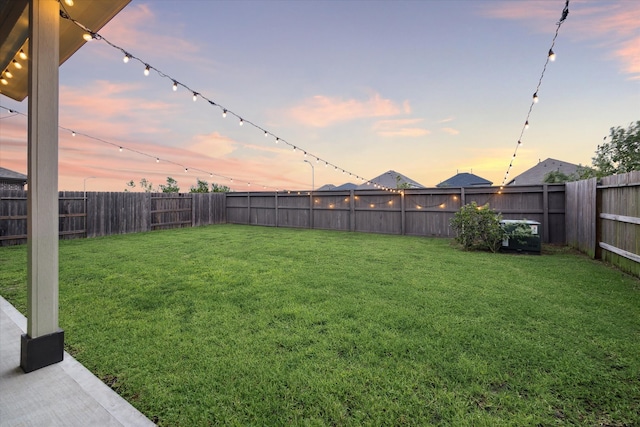 view of yard at dusk