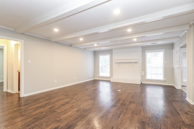 unfurnished living room with ornamental molding, dark wood-type flooring, and beamed ceiling