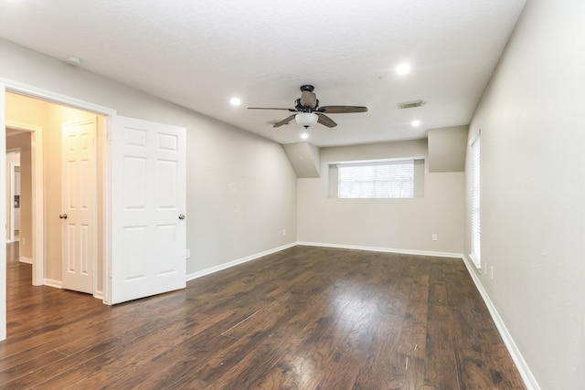 spare room featuring ceiling fan and dark hardwood / wood-style floors