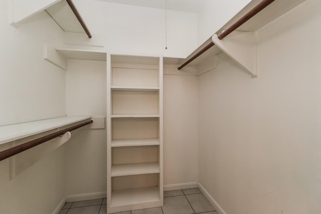 488 Stephen F Austin Dr, Conroe, TX 77302 - spacious closet featuring light tile patterned flooring