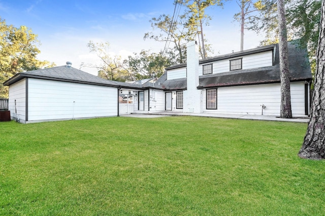 488 Stephen F Austin Dr, Conroe, TX 77302 - rear view of property with a patio area, a yard, and roof with shingles