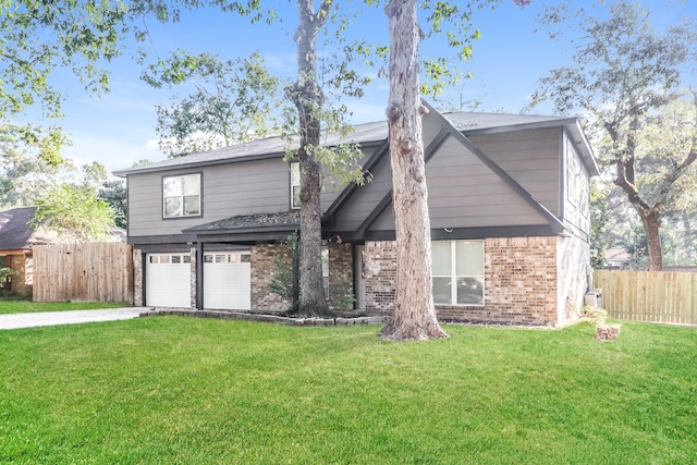 view of front of property with a garage and a front yard