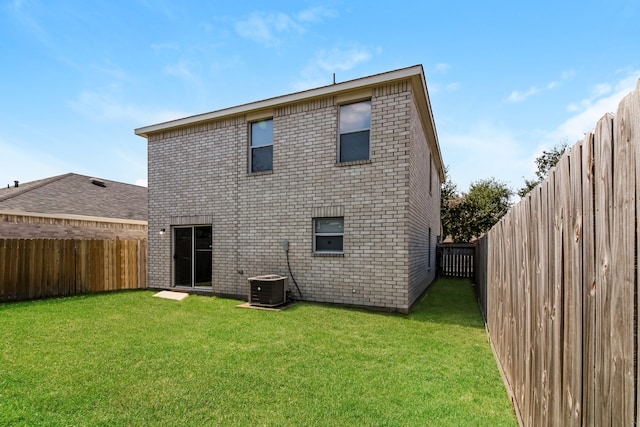 rear view of house with a yard