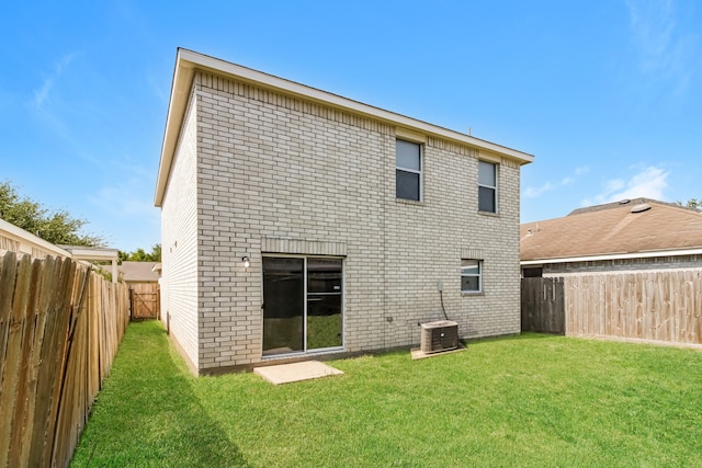 rear view of house with a lawn