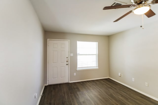 interior space with ceiling fan and dark hardwood / wood-style floors