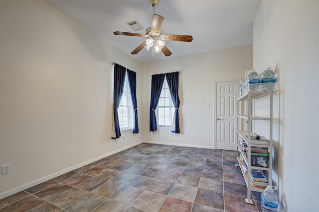 unfurnished room with ceiling fan