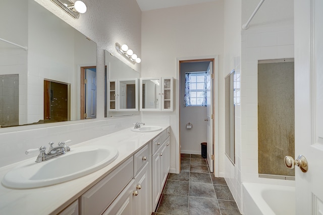 bathroom featuring vanity, a tub, and tile patterned floors