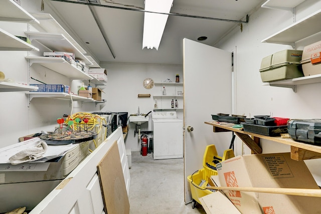 3215 County Road 160, Alvin, TX 77511 - kitchen featuring open shelves, washer / clothes dryer, and concrete floors