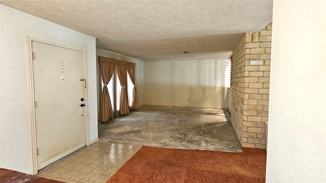 entryway featuring a textured ceiling