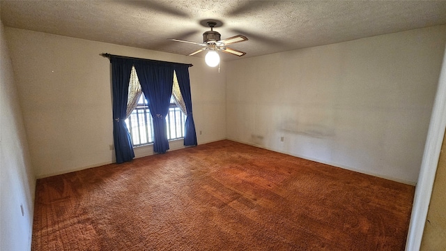 unfurnished room with carpet, ceiling fan, and a textured ceiling